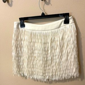 Super cute, fringed mini skirt. Never worn size2 Express. Length of skirt is 14”